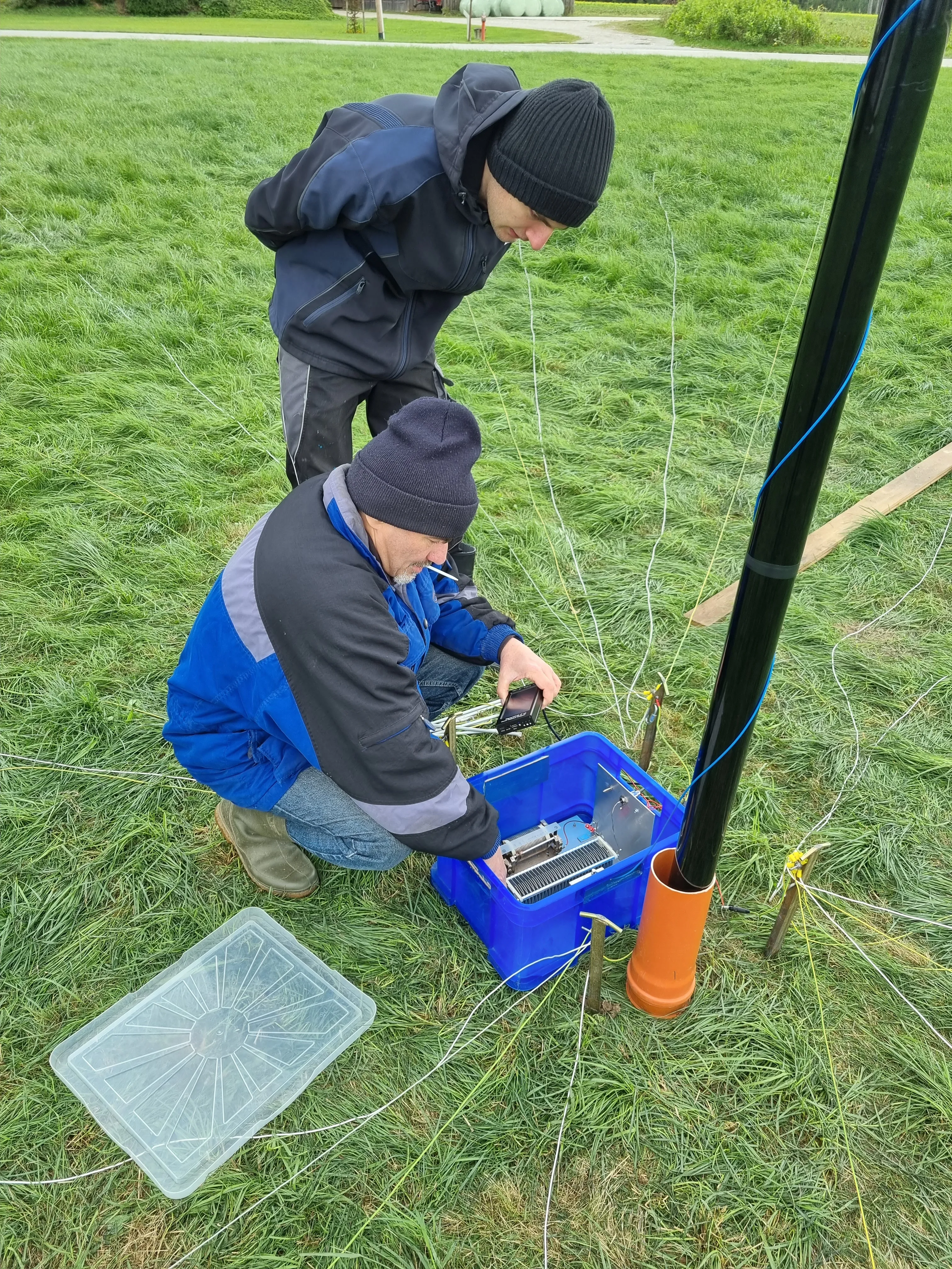 Co-Lead DJ4MX and DJ5MN testing the feed point for lowband antenna.jpg